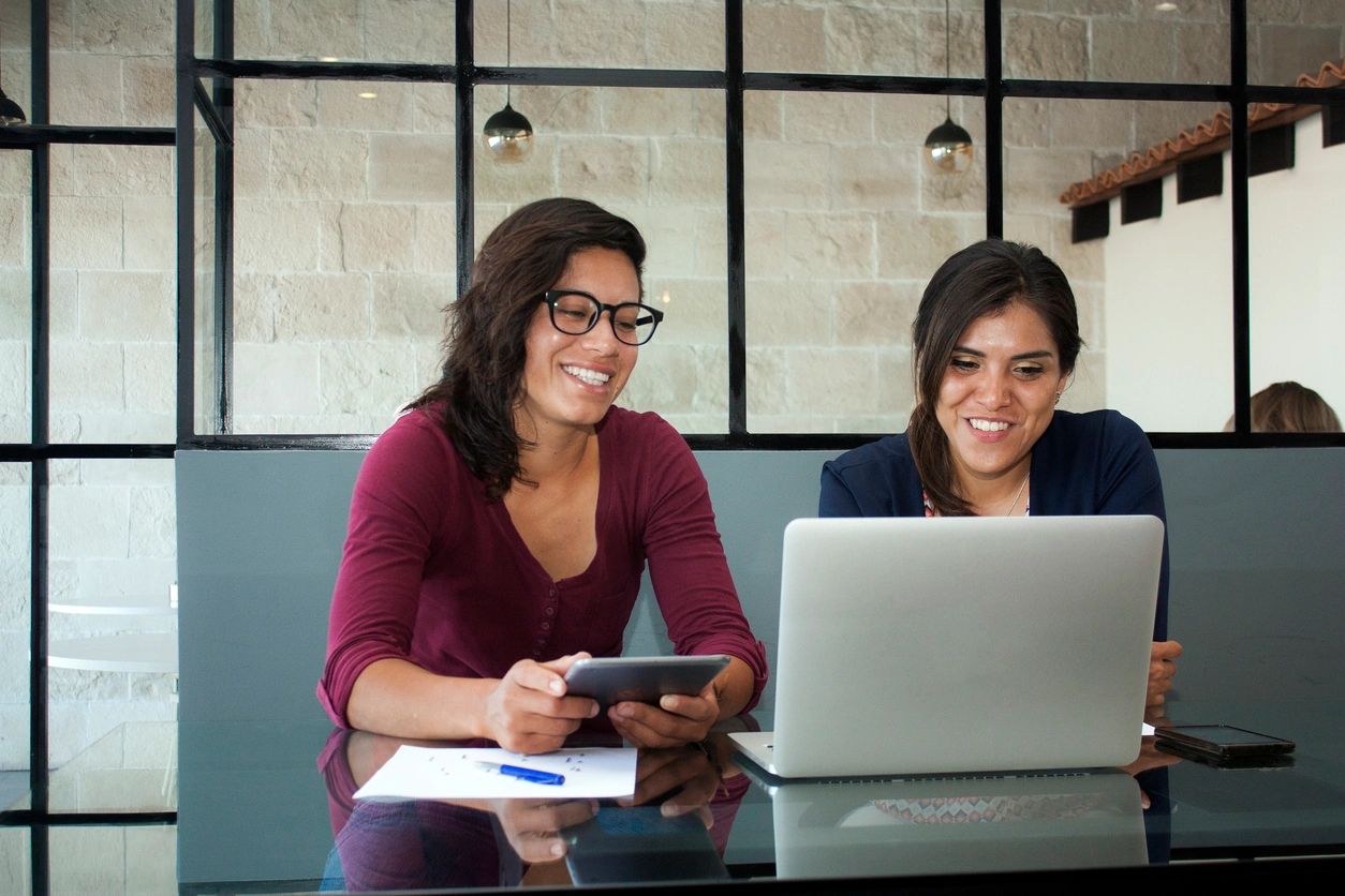 two women working at computer